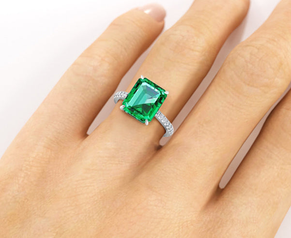 Masterpiece Octagonal Step cut Emerald Ring 5.55ct in Platinum - Four claw  set flanked with Trapeze and Bullet cut Diamonds | Pragnell